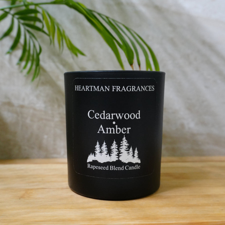 Heartman Fragrances Cedarwood and Amber luxury scented candle in a matte black jar