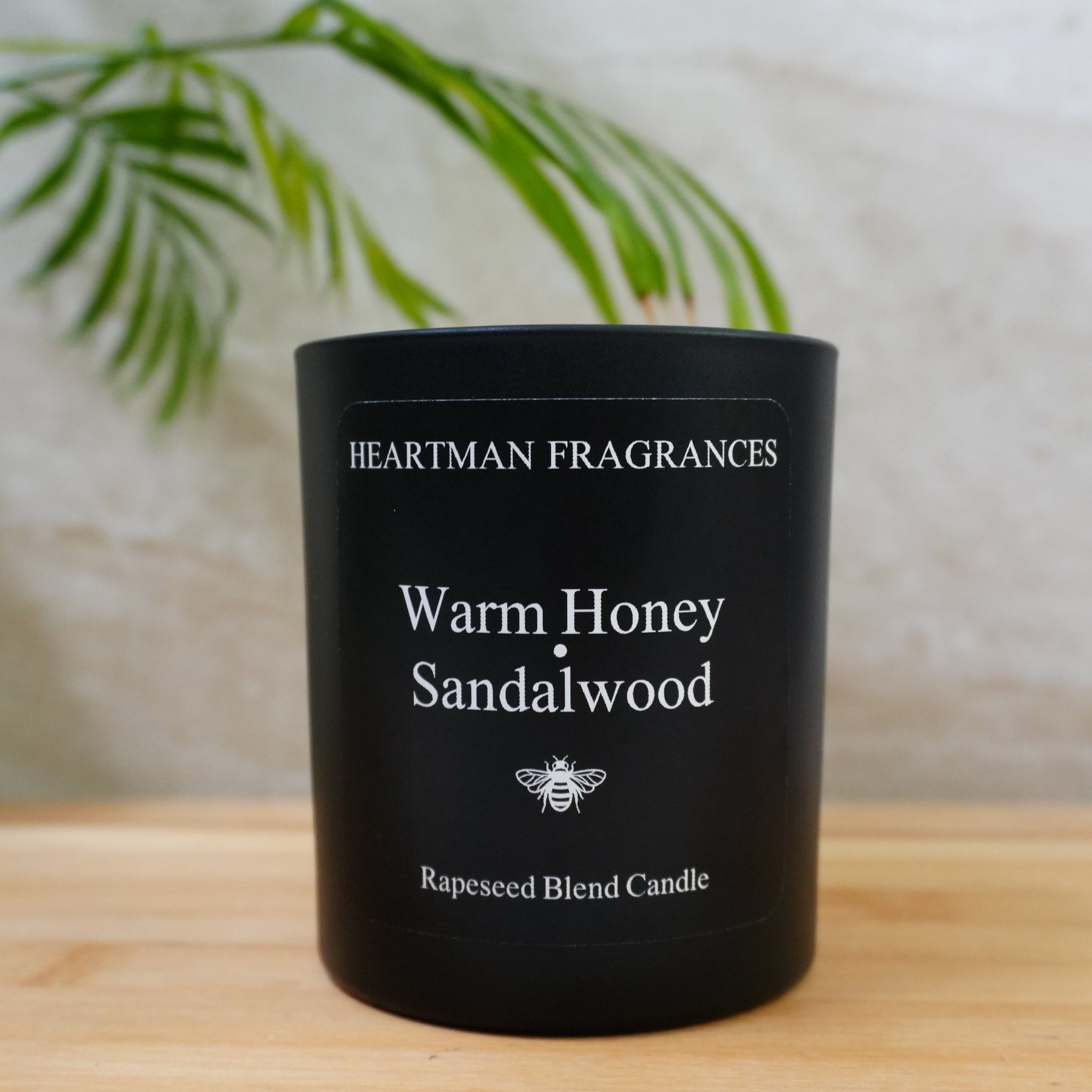Warm Honey and Sandalwood hand-poured candle by Heartman Fragrances, a soft scent for a bedroom