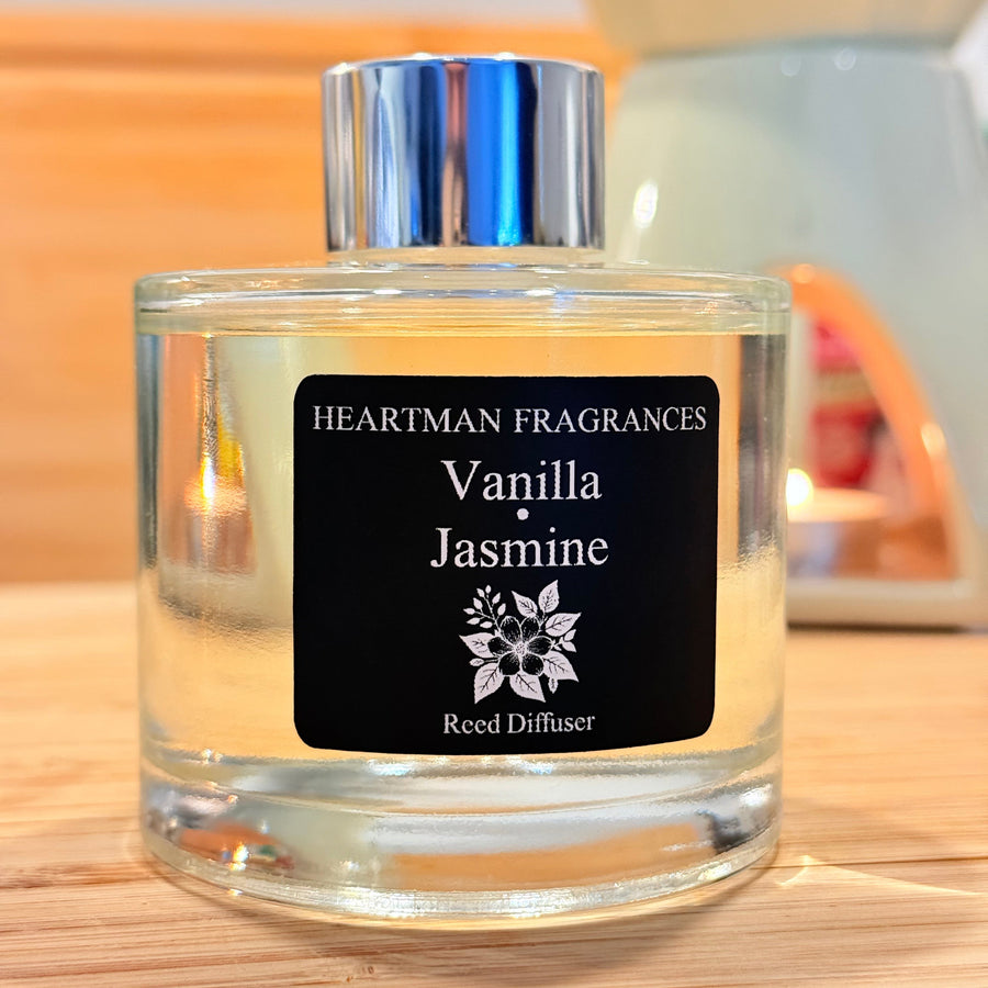 Vanilla and Jasmine reed diffuser by Heartman Fragrances on a wooden surface